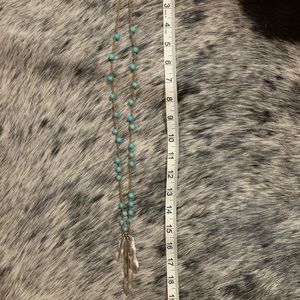 Long turquoise feather necklace
